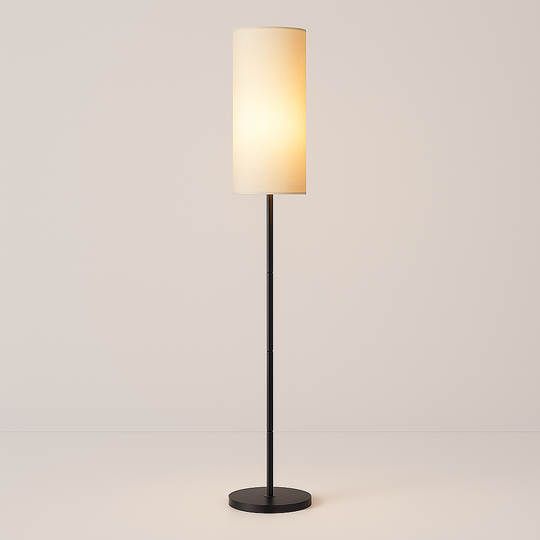 Tall slim floor lamp with cylindrical fabric shade and black base, 173 cm in height, shown beside a modern chair in a living room setting.