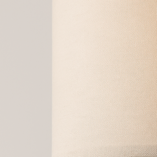 Tall slim floor lamp with cylindrical fabric shade and black base, 173 cm in height, shown beside a modern chair in a living room setting.