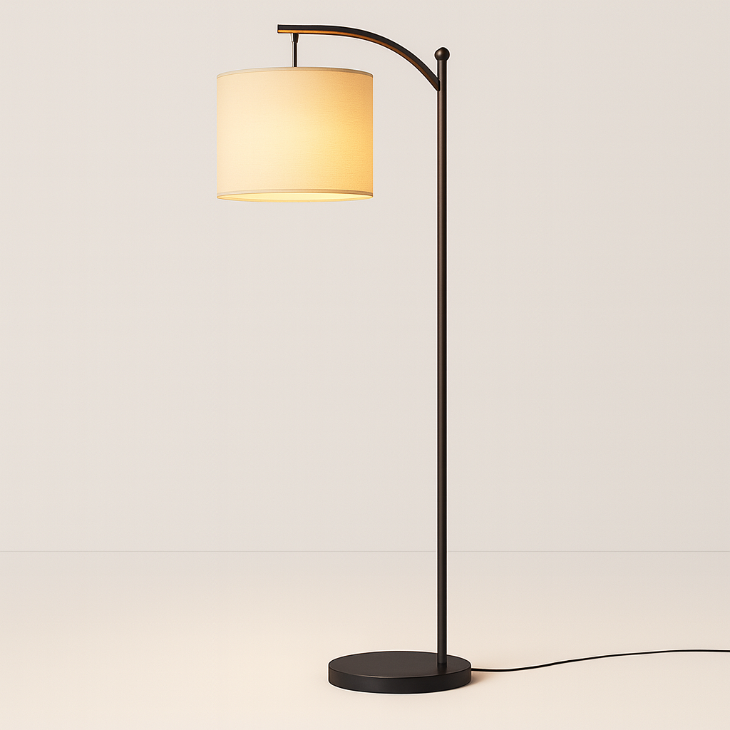 Tall arched floor lamp with black stand and ivory cylindrical shade, 158 cm in height, positioned beside an armchair in a cozy living room setting.
