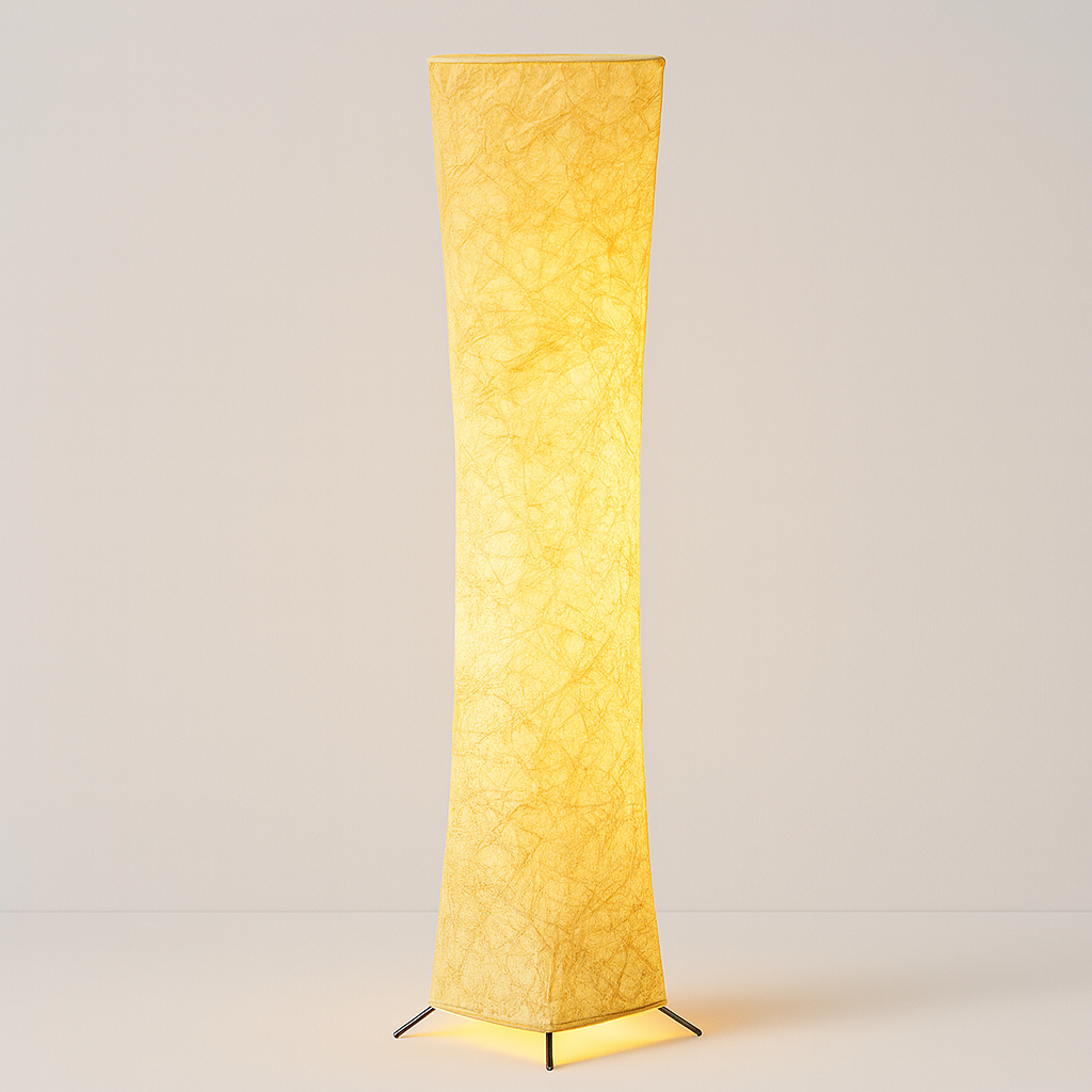 Tall sculptural floor lamp with textured fabric shade, glowing warmly at 130 cm height, shown against a softly lit interior background.