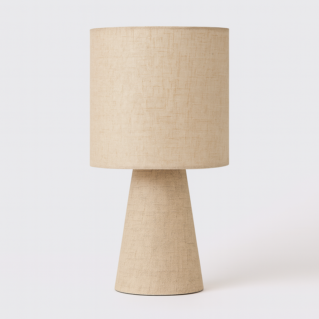 Beige linen table lamp with cylindrical shade and tapered base, shown against a clean studio background.