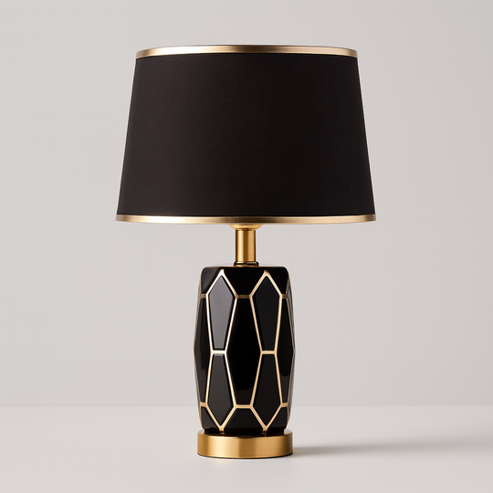 Black and gold geometric table lamp with faceted base and black fabric shade, 50 cm in height, shown on a plain background with size dimensions.
