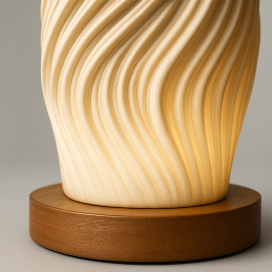 Wave-textured sculptural table lamp with warm LED glow and wooden base, measuring 21 cm tall, shown on a plain background.